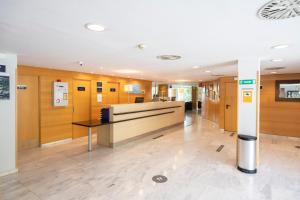 a lobby of an office with a reception desk at Holiday Inn Express Barcelona - Montmeló, an IHG Hotel in Granollers