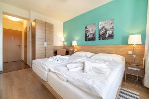 Posteľ alebo postele v izbe v ubytovaní Hotel Vyhlídka
