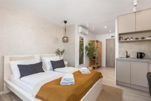 Postel nebo postele na pokoji v ubytování Apartments Penkala