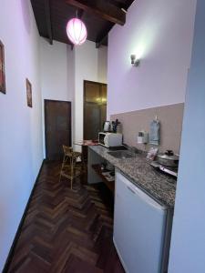 a kitchen with a counter top and a table at Apartment Salta 2 pax in Salta