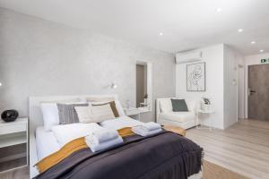 Postel nebo postele na pokoji v ubytování Apartments Penkala