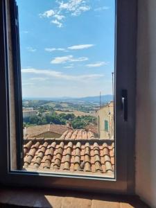 a view from a window of a roof at Tuscany boutique apartment in Manciano