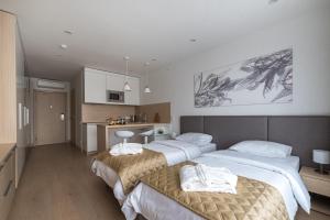 Posteľ alebo postele v izbe v ubytovaní Apart-hotel YE'S Botanica