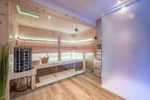 a wine tasting room with a glass wall at Das Apart Rauch Gurgl in Obergurgl