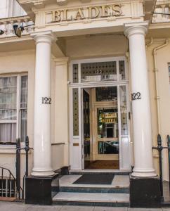 a store front with a front door with columns at Blades Hotel in London