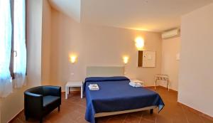 Postel nebo postele na pokoji v ubytování Hotel Rita Major