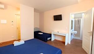 TV a/nebo společenská místnost v ubytování Hotel Rita Major