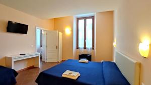 Postel nebo postele na pokoji v ubytování Hotel Rita Major