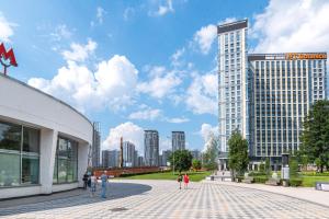 a rendering of a city with a tall building at Apart-hotel YE'S Botanica in Moscow