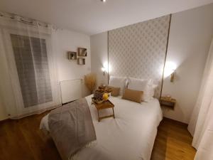 a bedroom with a large white bed and a window at La Boheme- Free Parking-Paris-Disneyland-Easy Check-in- Netflix in Rosny-sous-Bois +6 photos