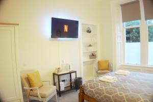 Postel nebo postele na pokoji v ubytování Barns Serviced Accommodation