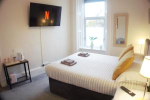 Postel nebo postele na pokoji v ubytování Barns Serviced Accommodation