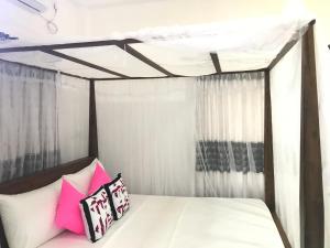 Postel nebo postele na pokoji v ubytování Jilan Homestay