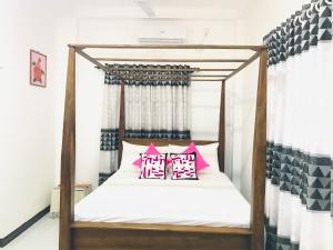 Postel nebo postele na pokoji v ubytování Jilan Homestay