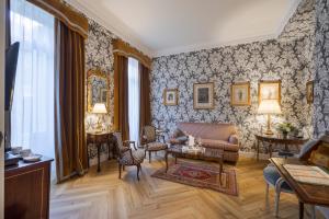 a living room with a couch and a table at Relais & Châteaux Hotel Orfila in Madrid