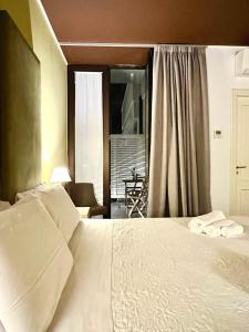 Ліжко або ліжка в номері Dimora dei Salentini