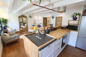 a kitchen with a sink and a counter top at Le cocon aux portes de la place Stanislas in Nancy