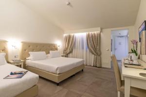 Säng eller sängar i ett rum på Hotel Accademia