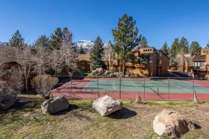 a tennis court with rocks in front of it at Sunrise 9 in Mammoth Lakes