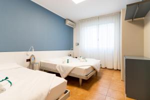 Кровать или кровати в номере Summer Time Family Resort