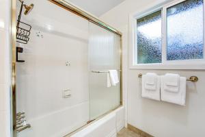 a bathroom with a shower and a window at Hummingbird Garden Retreat in Santa Rosa +23 photos