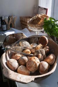 a tray of breads and pastries on a table at das-hornsteiner in Passau