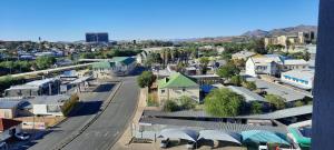 an aerial view of a city with buildings and a street at Kingelph Stylish 1- Bedroom Apartment in Windhoek