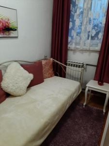 Кровать или кровати в номере Apartman Hana