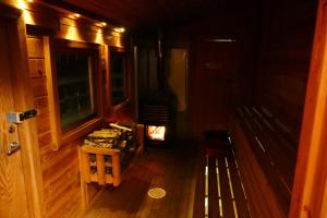 an inside view of a cabin with a wooden floor at Reindeer Lodge in Jukkasjärvi +52 photos
