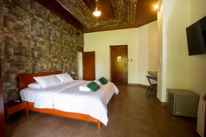 Tempat tidur dalam kamar di Lodge Casa de Campo "APU SAMAY"