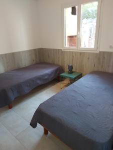 Résidence Les Pavillons du Belvédère客房内的一张或多张床位