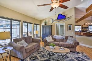 a living room with two couches and a ceiling fan at Updated Cottonwood Home with Patio and Fire Pit! in Cottonwood