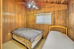 A bed or beds in a room at Cornell Home with Fire Pit and Hunting Access!