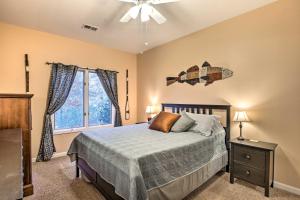 a bedroom with a bed and a window at Lake Hartwell Home with Private Dock and Hot Tub! in Lavonia
