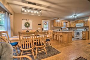 a kitchen and dining room with a table and chairs at Spacious Home in Helen with Porch and Balcony! in Helen