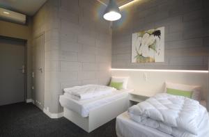 Postel nebo postele na pokoji v ubytování Cubby Hotel