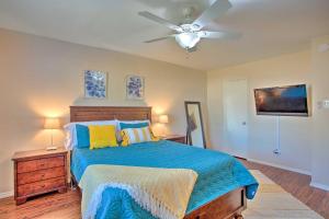 a bedroom with a bed and a ceiling fan at Plano Home with Private Yard Less Than 5 Mi to Downtown! in Plano