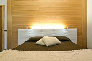 Postel nebo postele na pokoji v ubytování Hotel Ferrovia