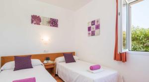 Postel nebo postele na pokoji v ubytování Villas Serena