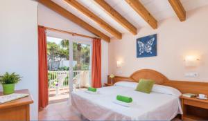 Postel nebo postele na pokoji v ubytování Villas Serena + 11 fotografií
