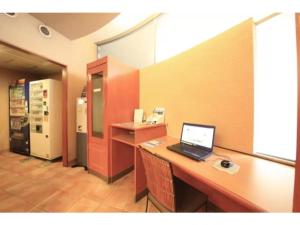 an office with a desk with a laptop computer on it at R&B HOTEL MORIOKA EKIMAE - Vacation STAY 38792v in Morioka