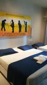 Hotel Encontro do Sol tesisinde bir odada yatak veya yataklar