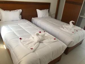 Postel nebo postele na pokoji v ubytování Hôtel Zahrat Souss -Inezgane