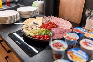 a table with a plate of food on a counter at U Komárků in Špindlerův Mlýn