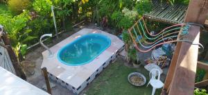 Bazén v ubytování Casa Verde Residence - Piscina , conforto e localização na Praia do Forte nebo v jeho okolí