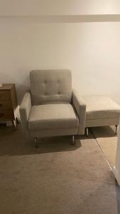 a couch sitting in a living room next to a table at DealHouse F7- Apartments in Huddersfield