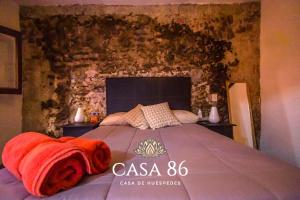 Tempat tidur dalam kamar di Casa 86