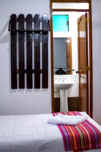 Postel nebo postele na pokoji v ubytování Peru Coca B&B Machupicchu