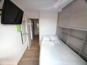 Postel nebo postele na pokoji v ubytování Apartamentos Medano - Lagos de Miramar Deluxe