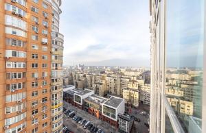 an aerial view of a city with tall buildings at luxury apartments Smartplaza Obolon metro Minskai in Kyiv